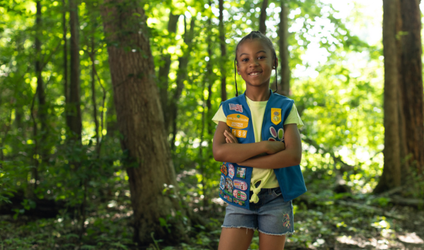 girl scout daisy posing in the woods