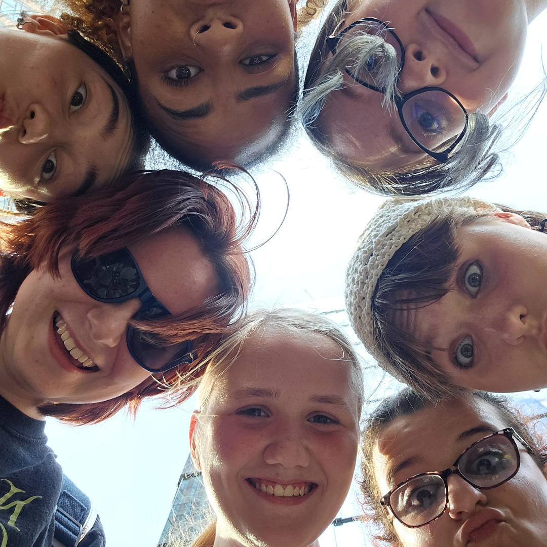 girl scouts taking upside down selfie
