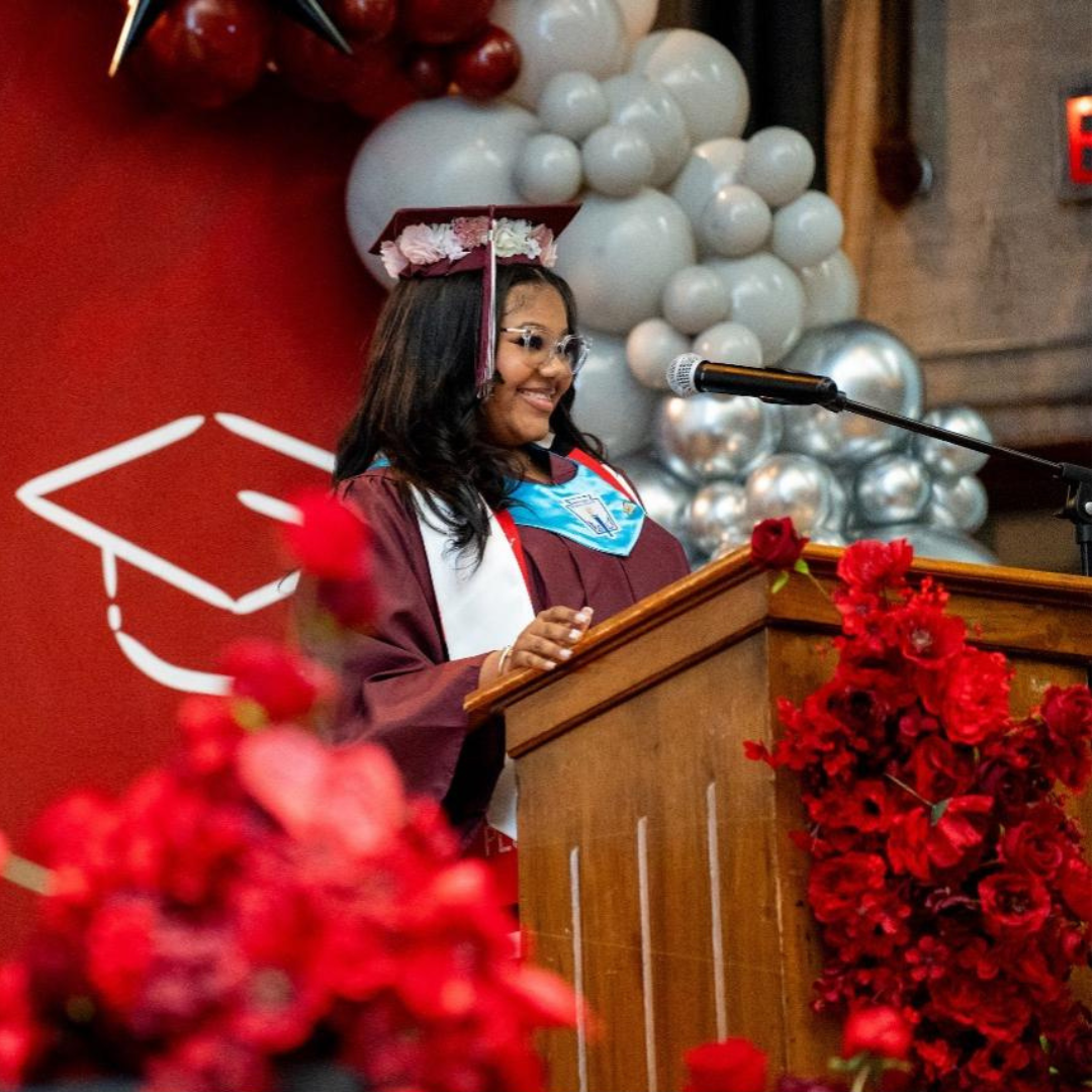 older girl scout speaking at high school graduation