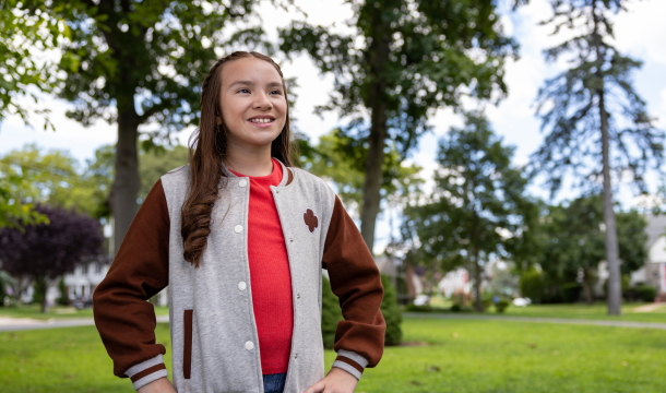 girl scout standing smiling