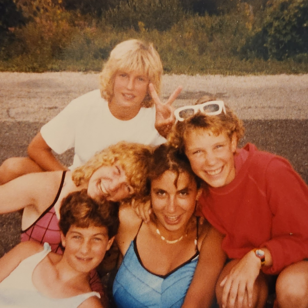 five girl scouts smiling at camera