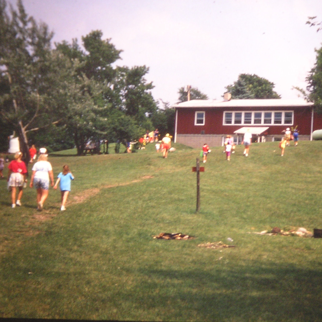 vintage photo of chinook program center with campers hiking