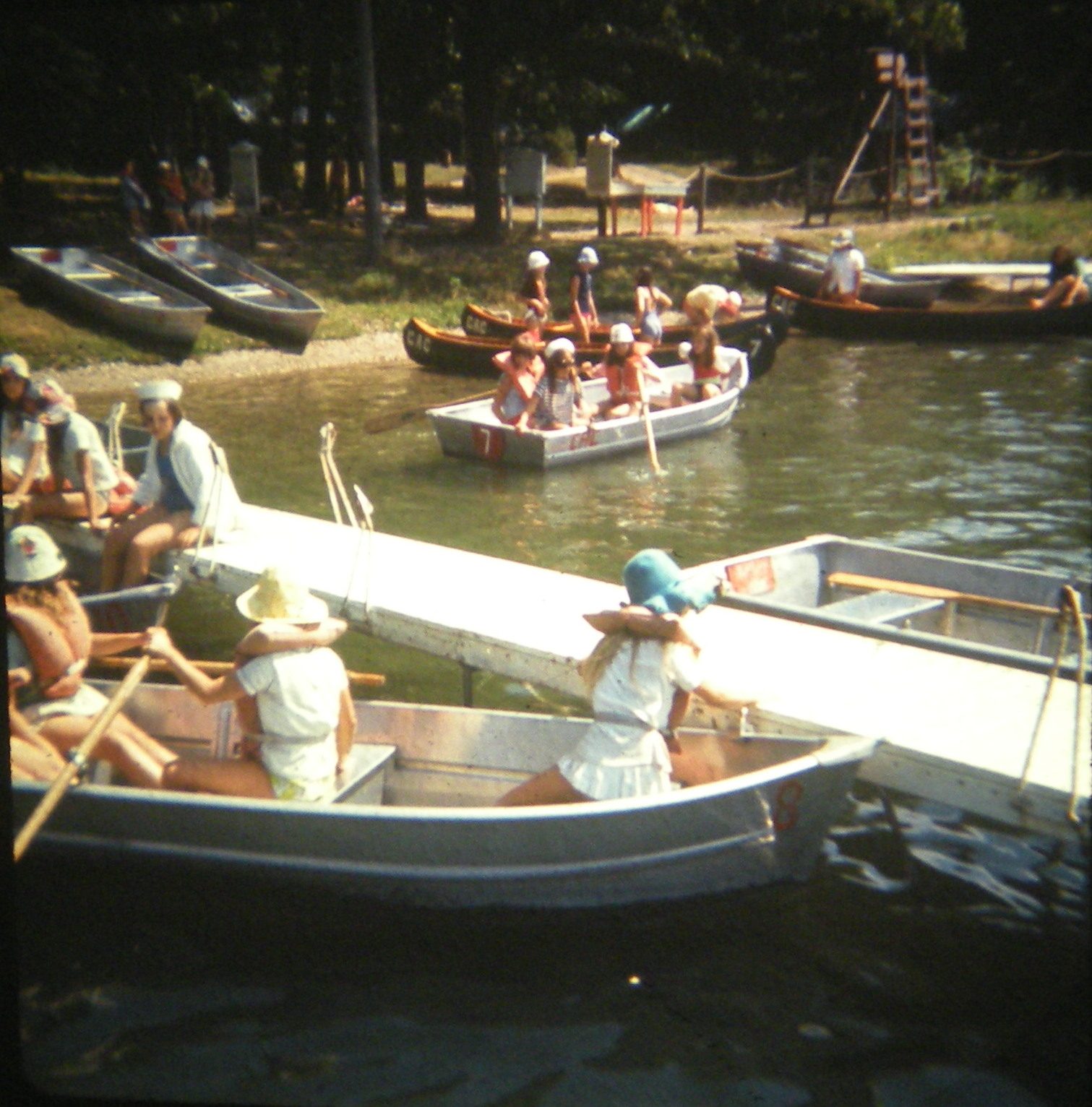 vintage photo of campers boating in booth lake