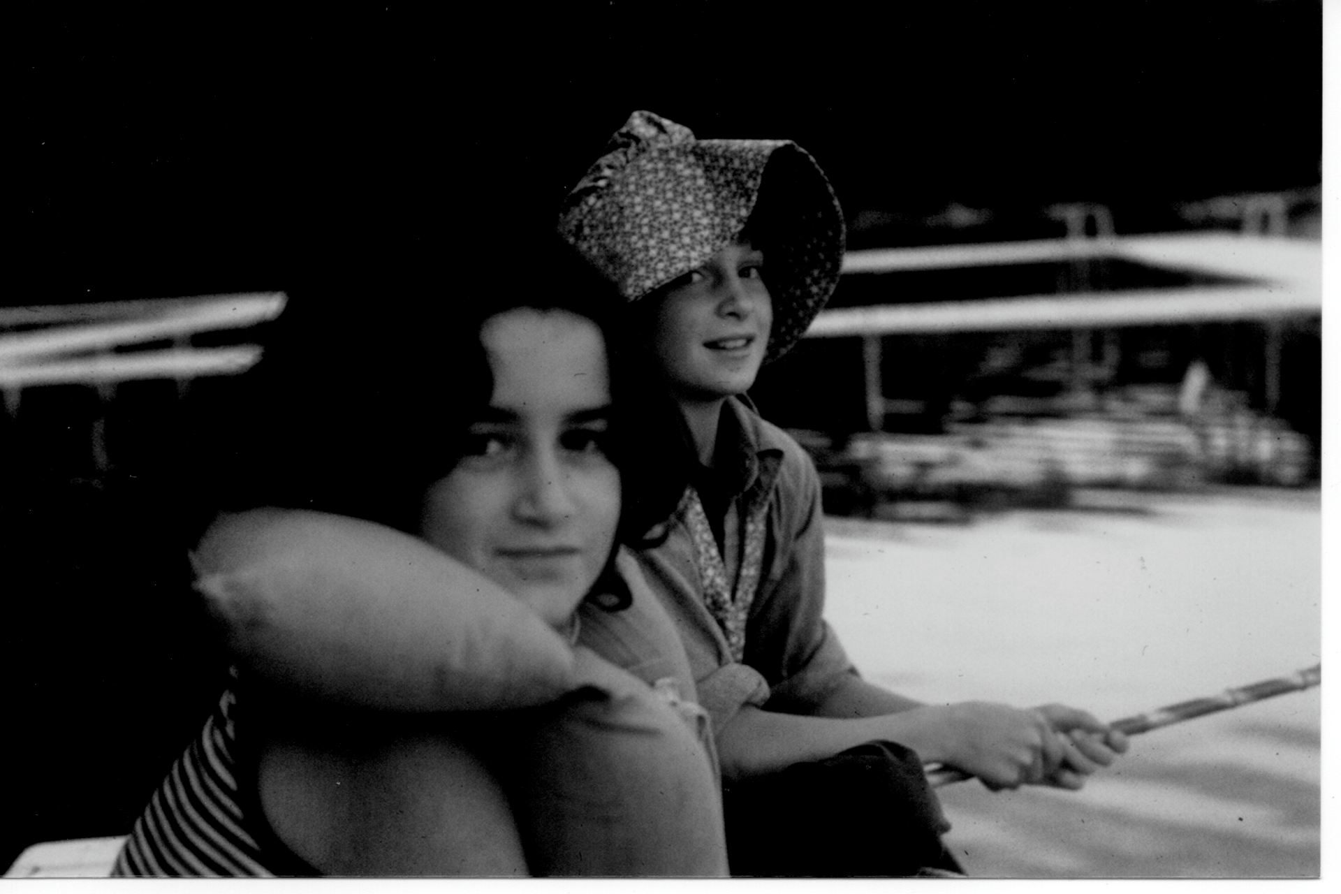 vintage black and white photo of two girl scouts fishing at camp