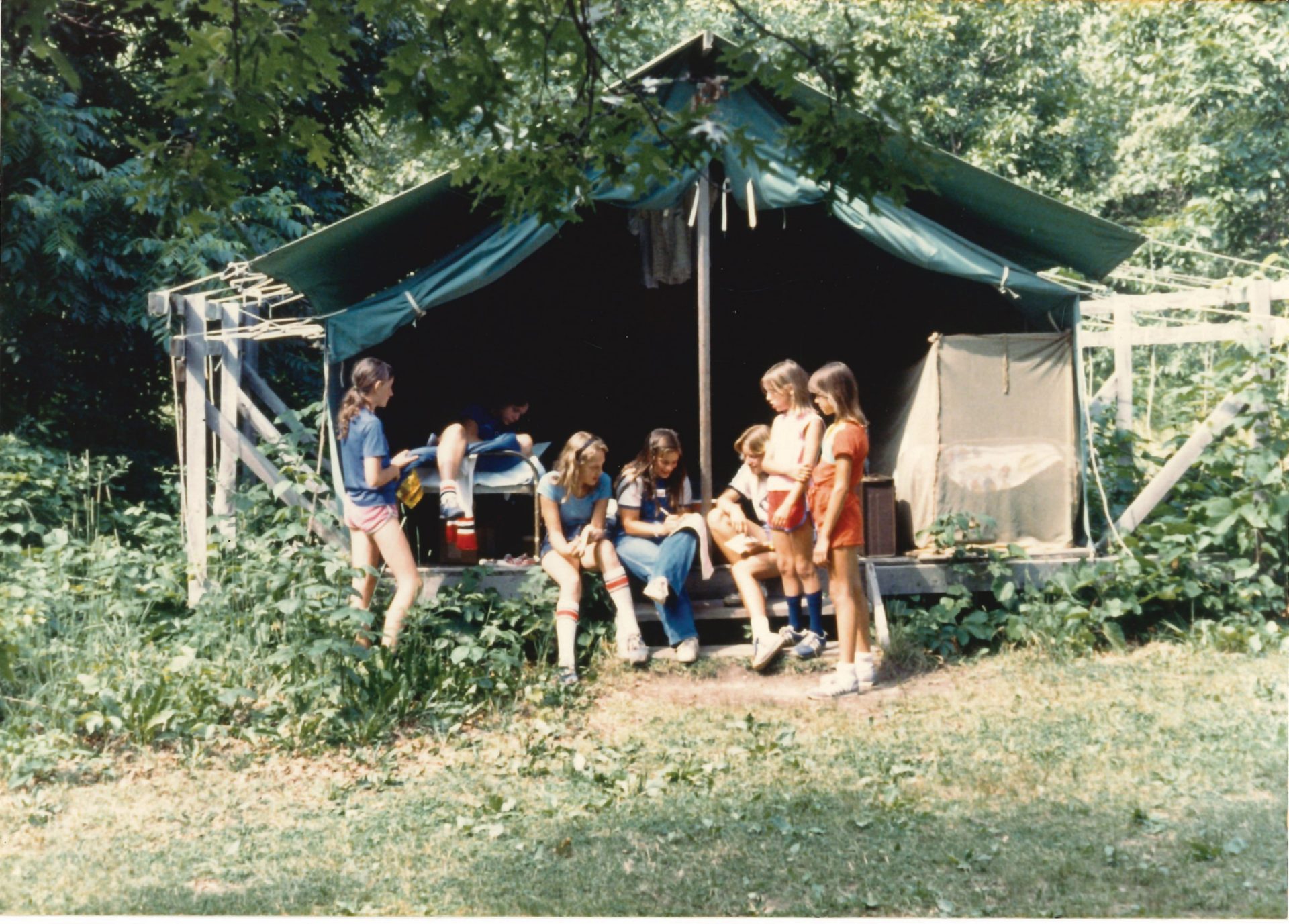 campers outside of platform tent