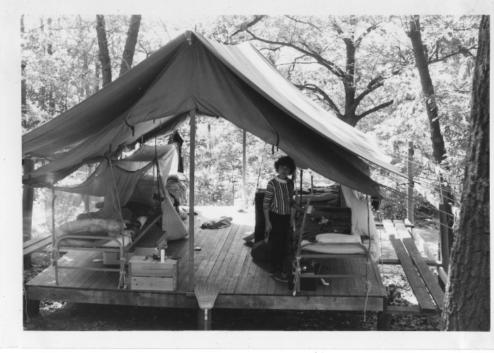 historic vintage black and white photo of girl scout in tent