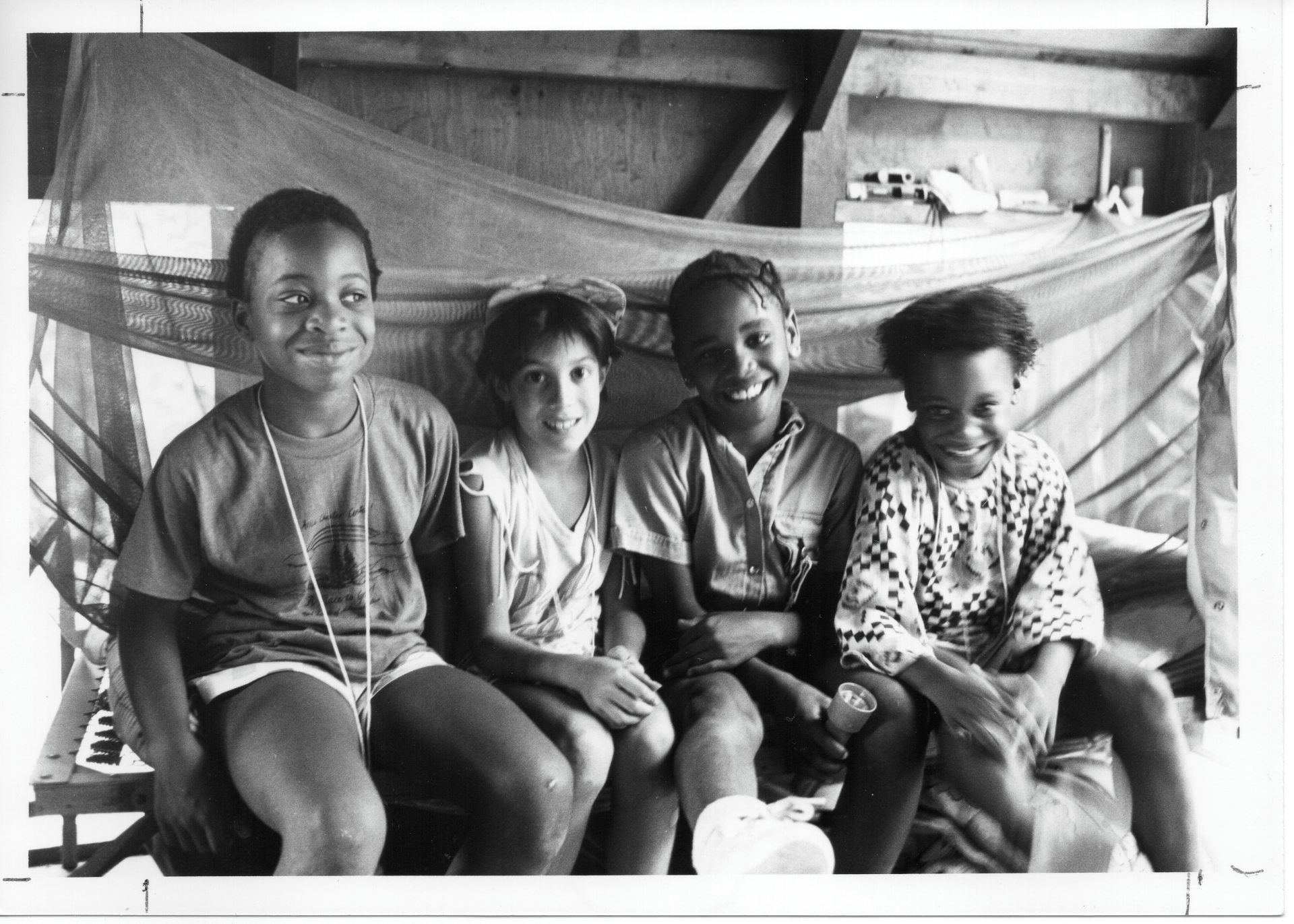 vintage black and white photo of four girl scout campers