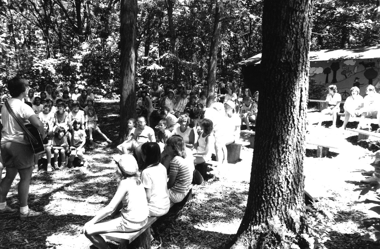 vintage black and white photo of girl scouts gathered on singing steps at camp alice chester