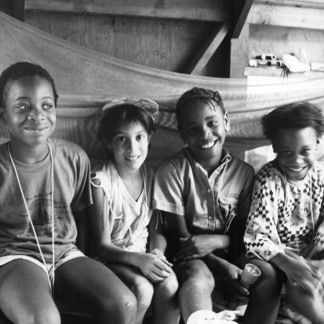 vintage black and white photo of four campers