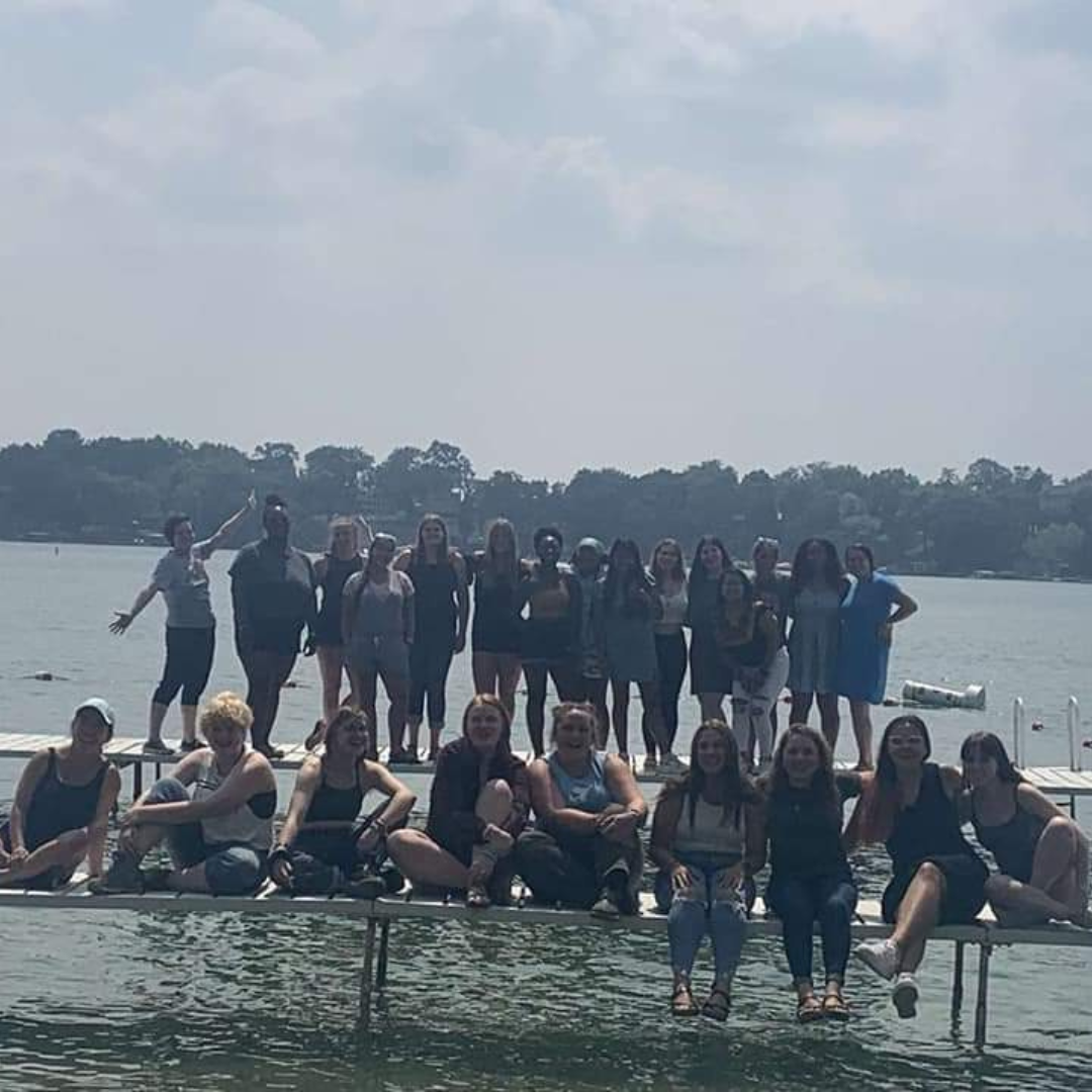 group of campers and counselors on swimming pier