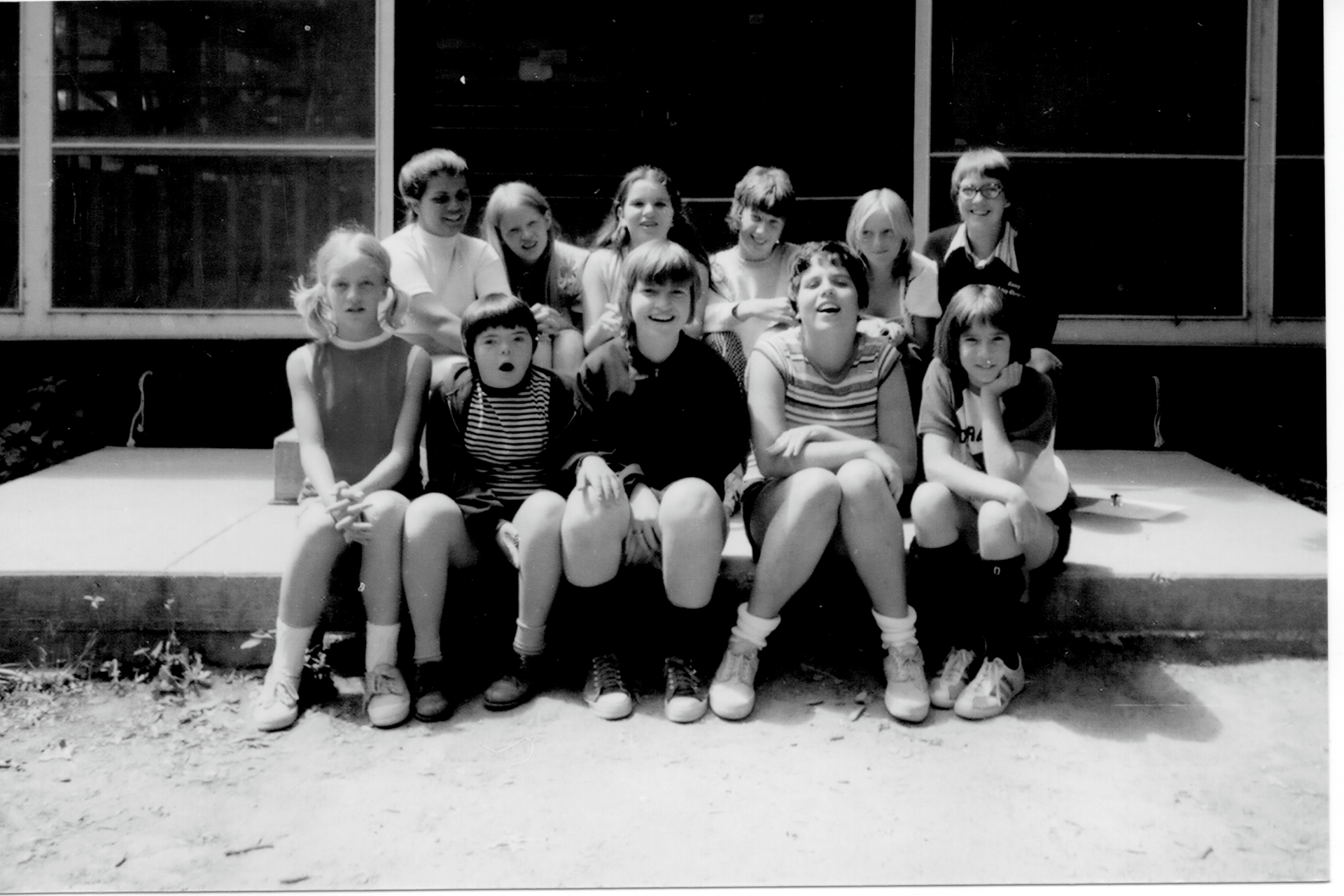 historic vintage black and white photo of campers outside