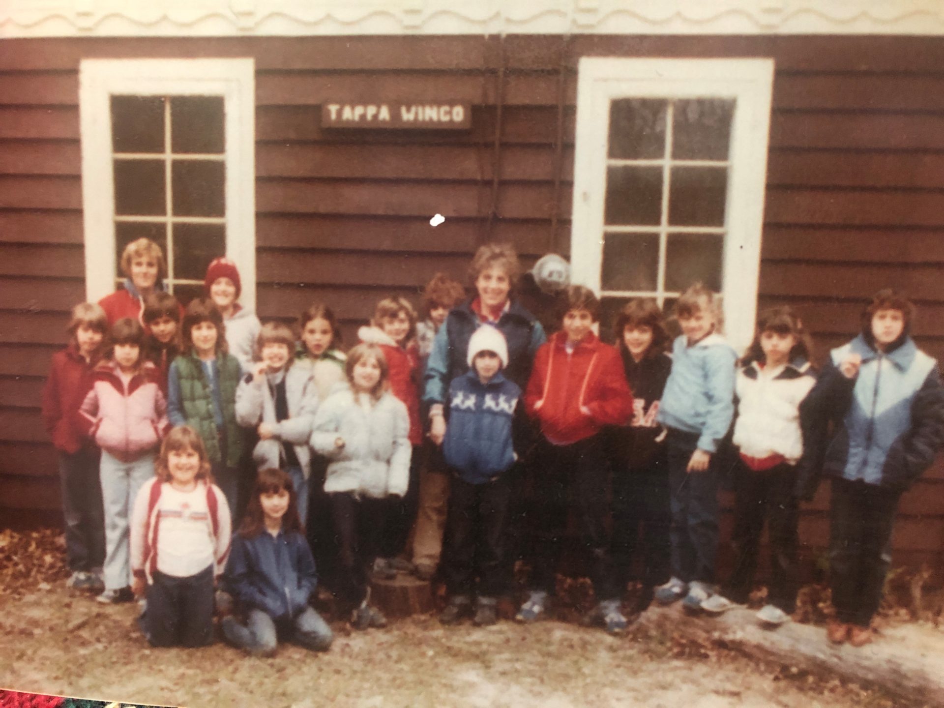 Andrea Yanacheck's brownie troop standing in front of the Camp Alice Chester Welcome Center