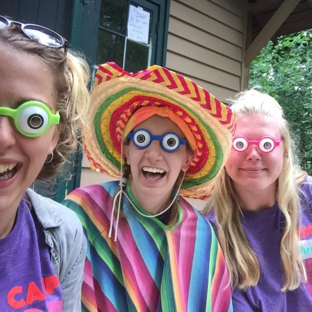 three girl scouts with silly eye masks