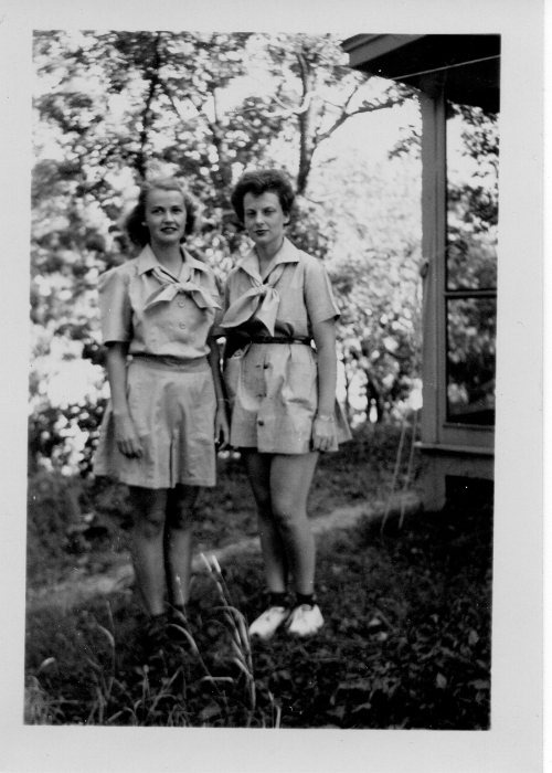 historic vintage black and white photo of two girl scouts at camp