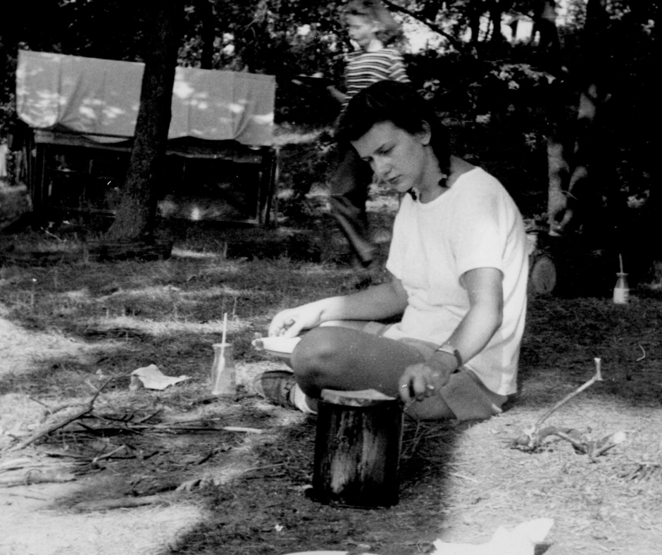 historic vintage black and white photo of girl scout at camp