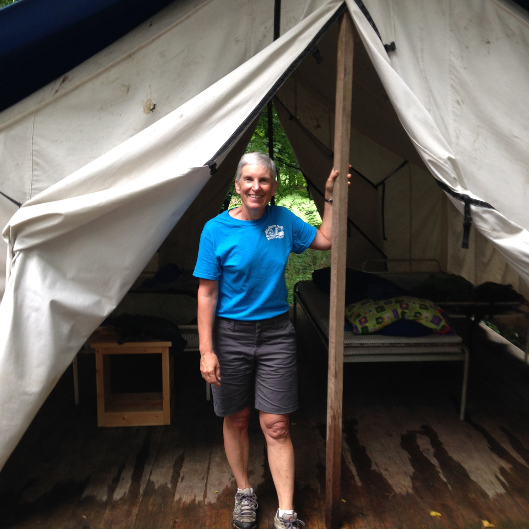 girl scout alum in platform tent