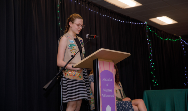 girl scout speaking at podium
