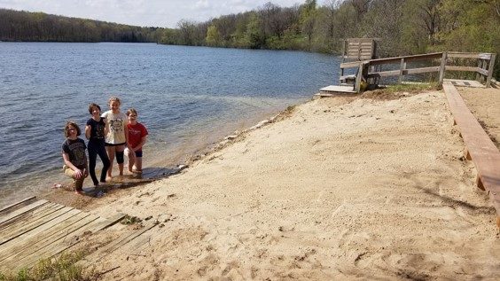 Girl Scouts cleaning up a shoreline