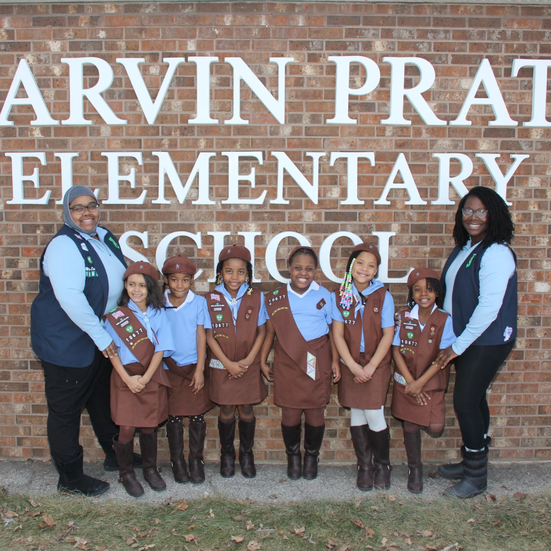brownie girl scout troop with troop leaders
